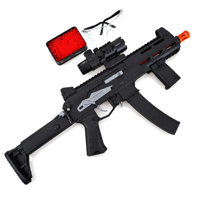 Black PPK 20 gel blaster with orange muzzle tip, scope and foregrip, shown beside gel balls and goggles